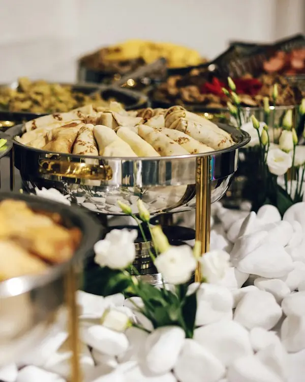 Wedding buffet with silver chafing dishes